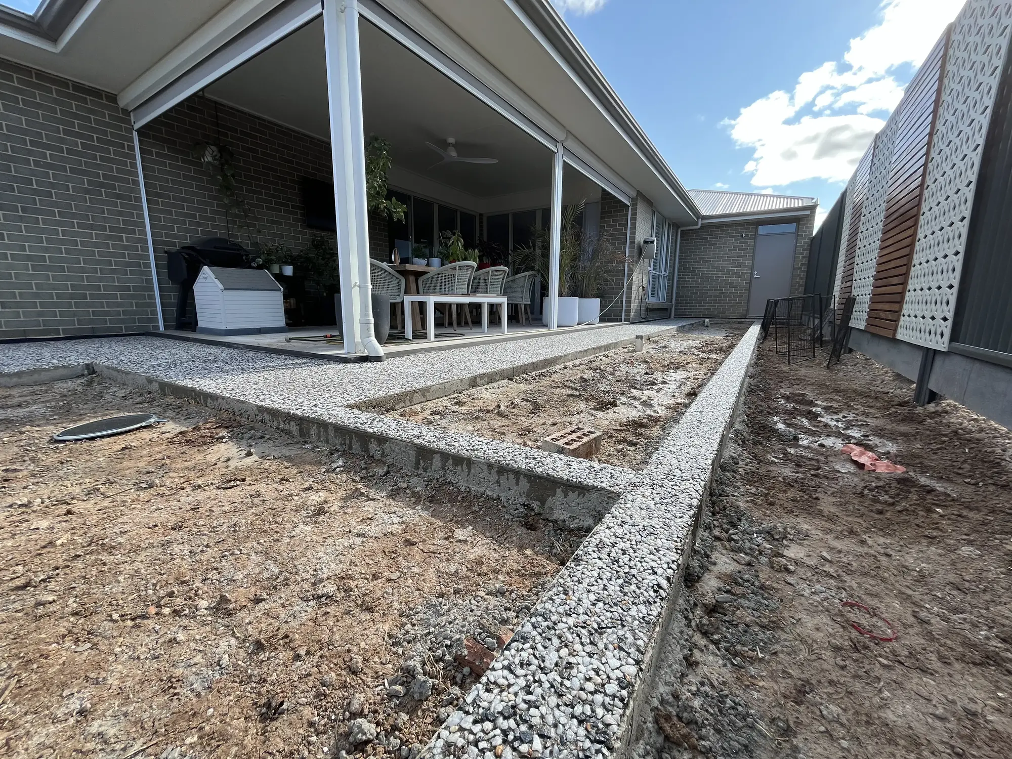 Exposed aggregate concrete sections.